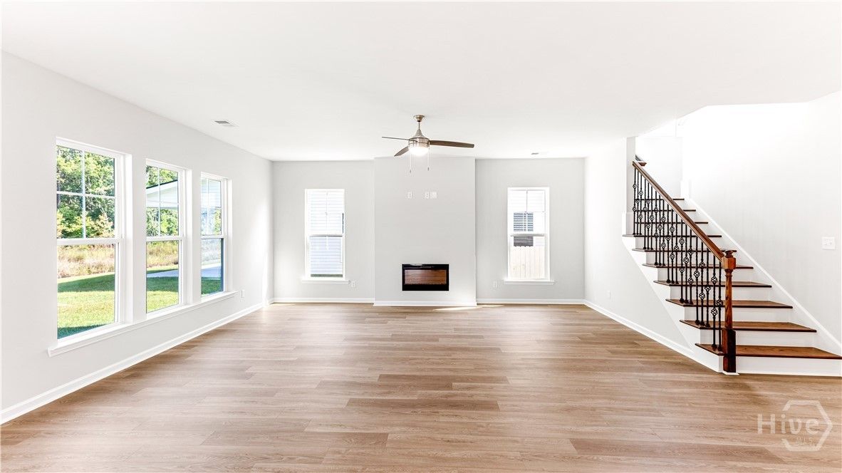 Open-concept living with tons of windows. Electric