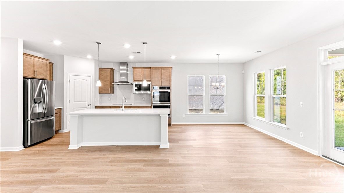Beautiful kitchen with quartz countertops and gour
