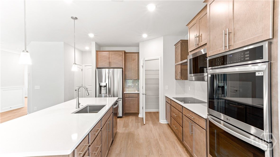 Beautiful kitchen with quartz countertops and gour