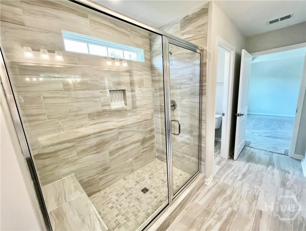Primary bathroom. Gorgeous 6' tiled shower-only wi