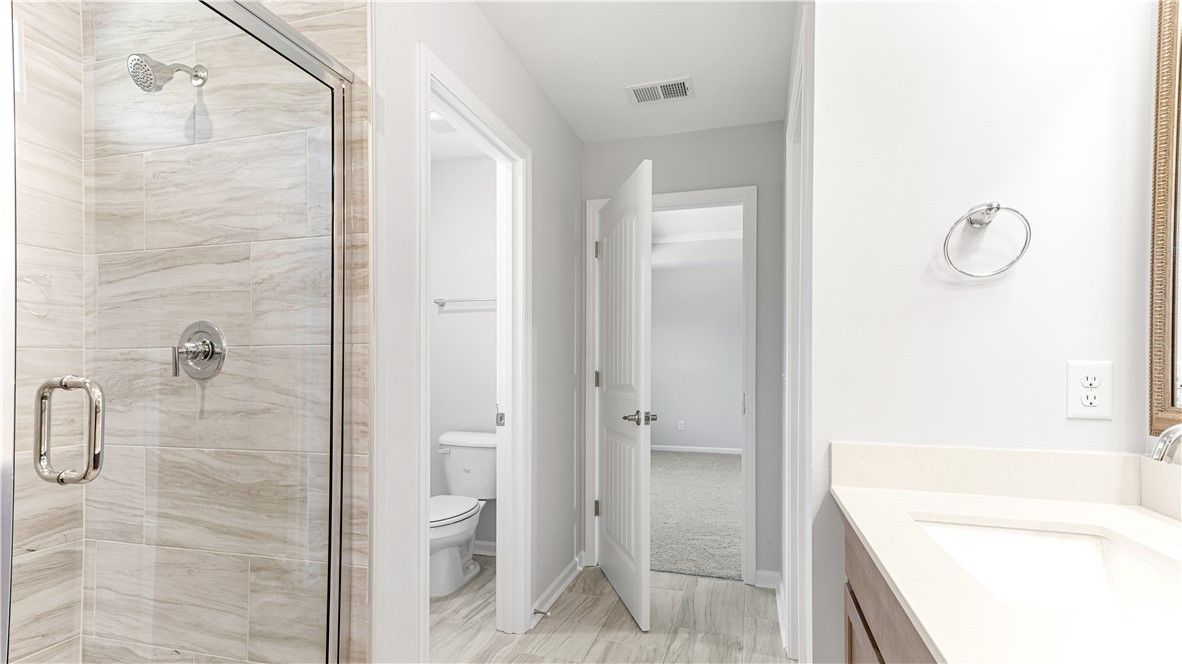 Primary bathroom. Gorgeous 6' tiled shower-only wi