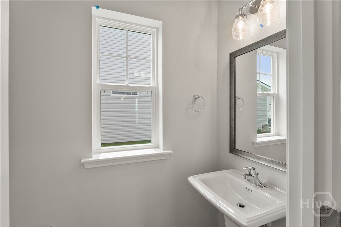 Downstairs powder room. Upgraded "logan square" pe