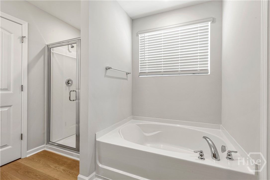 Primary Bathroom with Separate Garden Tub and Sepa