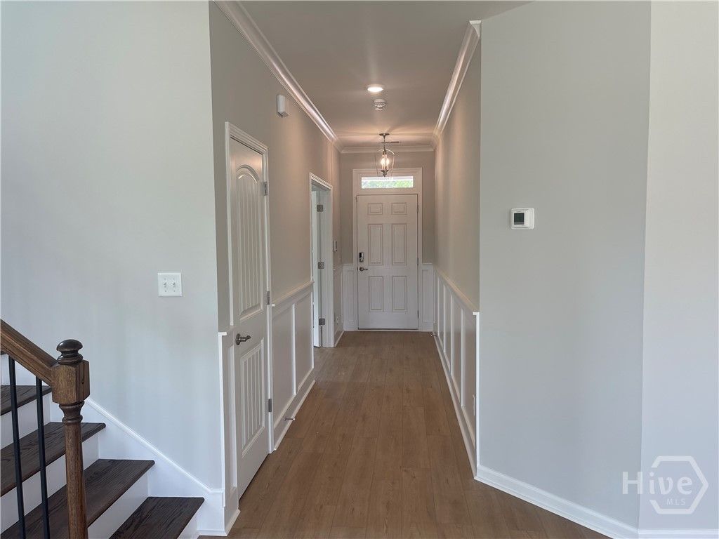 Wide Foyer with Wainscotting and Crown