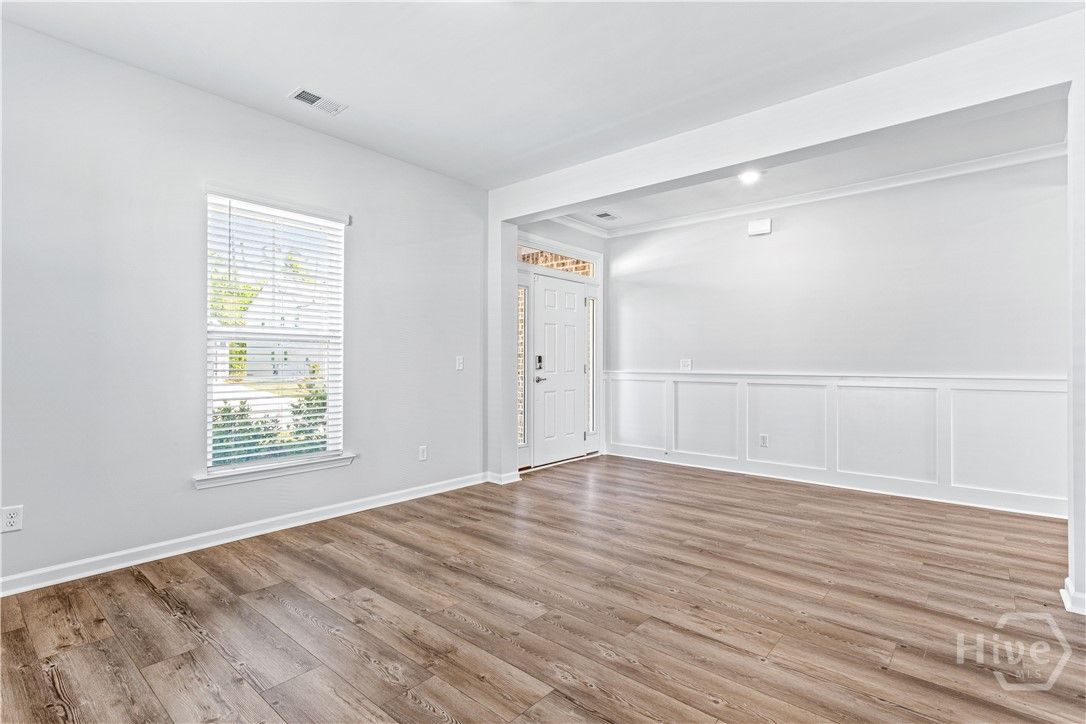 Grand Entrance With Flex Space, Wainscotting and C