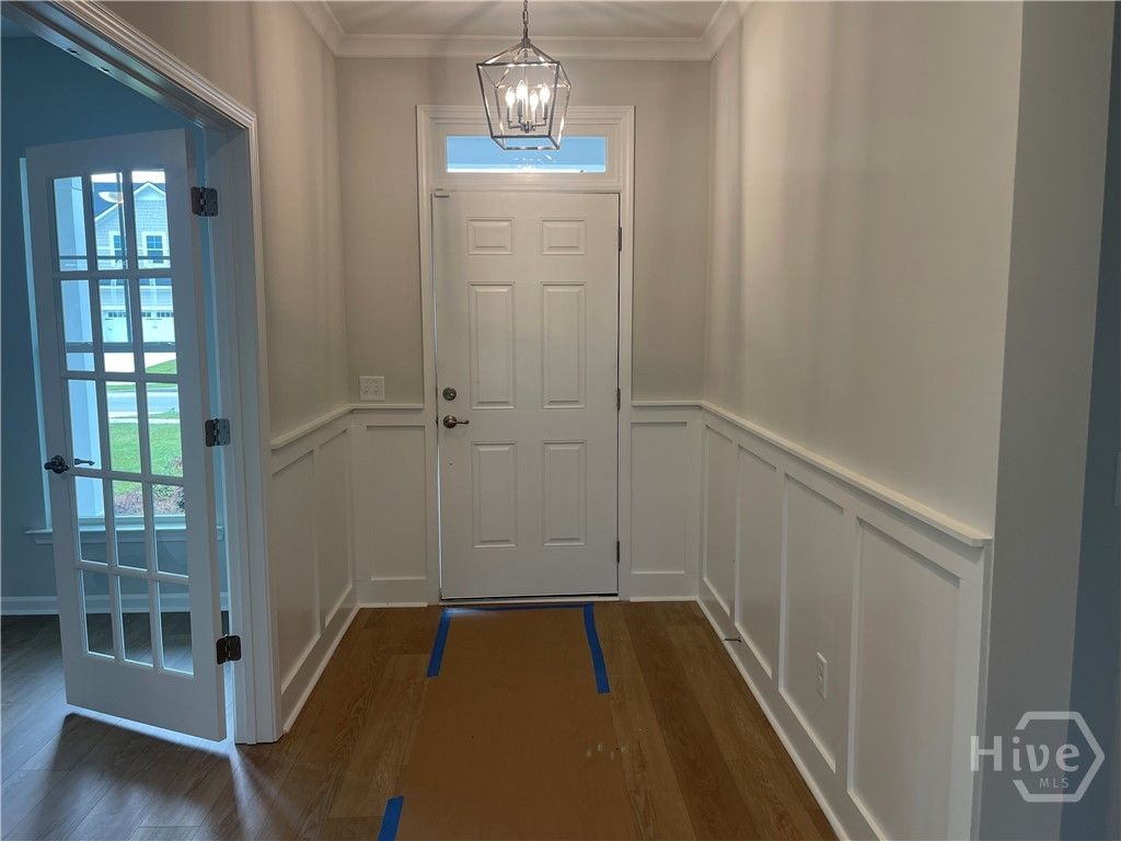 Grand Foyer with Wainscotting and Crown Molding