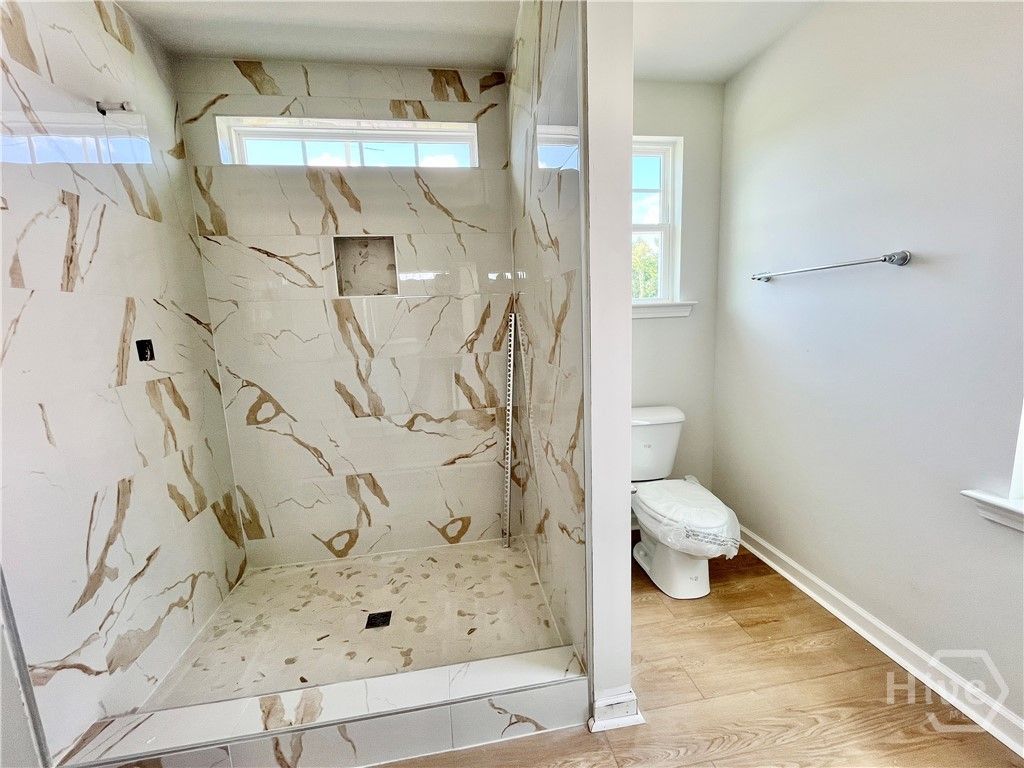 Primary bathroom. 5' tiled shower will have a glas