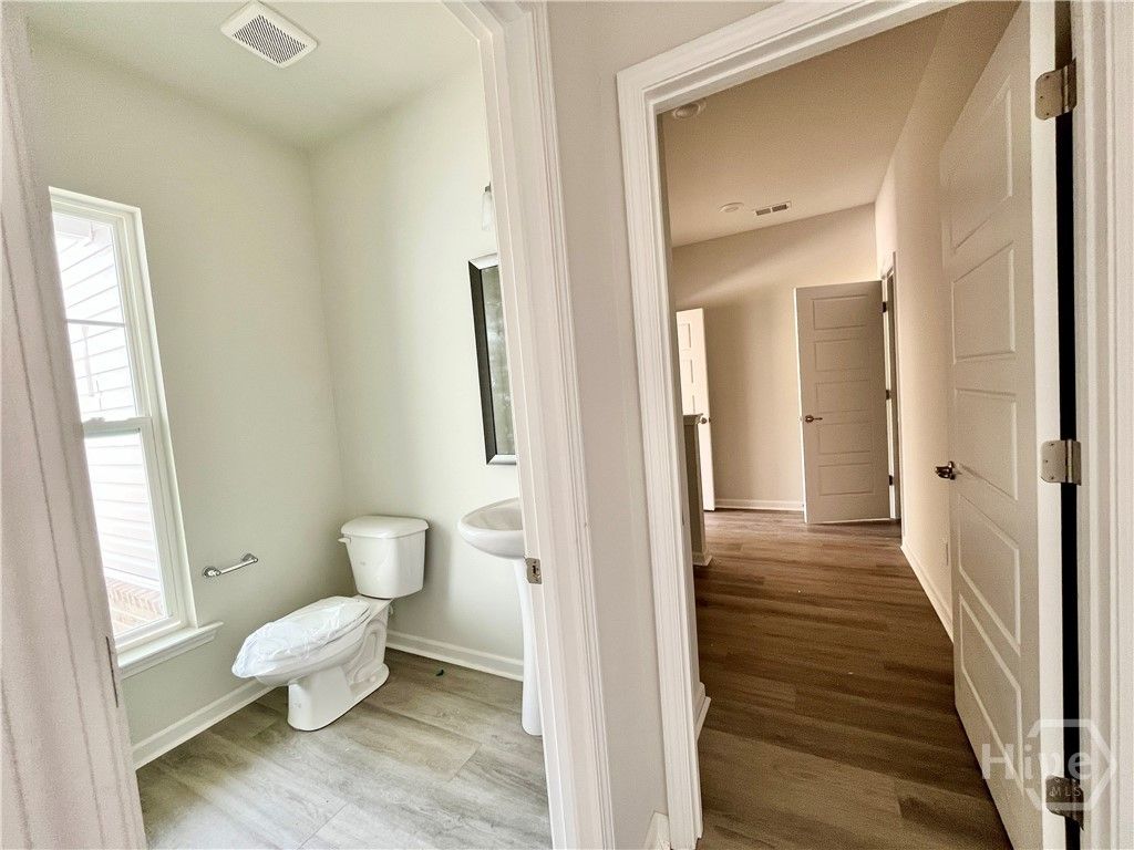 Powder room located conveniently by the front door