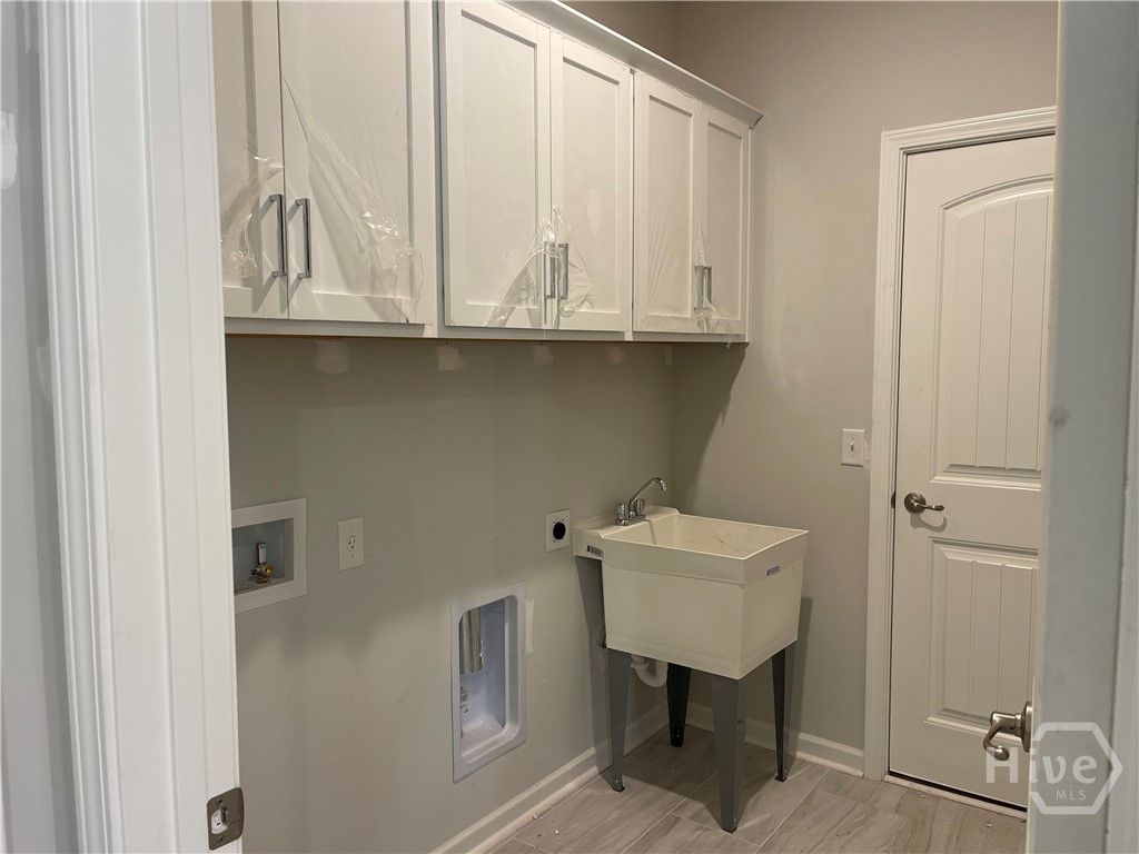 Laundry Room With Laundry Sink Downstairs