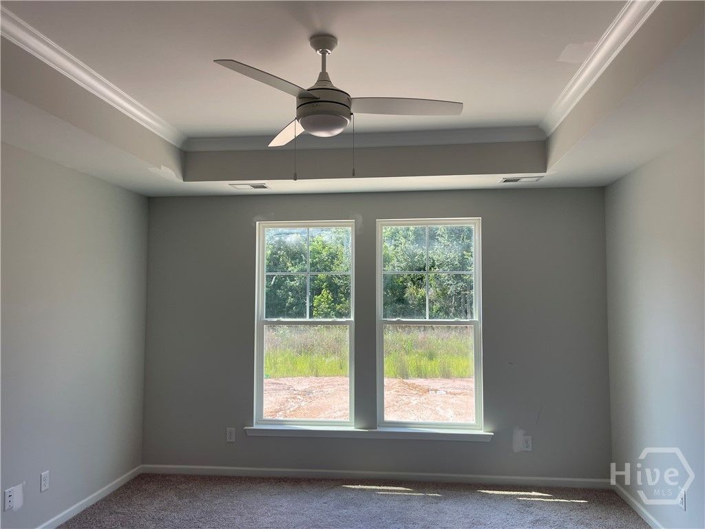 Primary Downstairs With Tray Ceiling