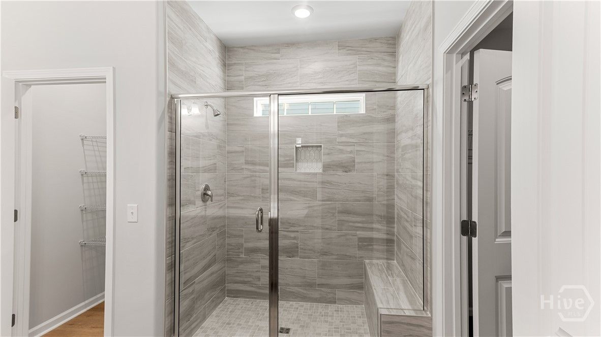 Primary Bathroom with Tile Shower with Bench Seat