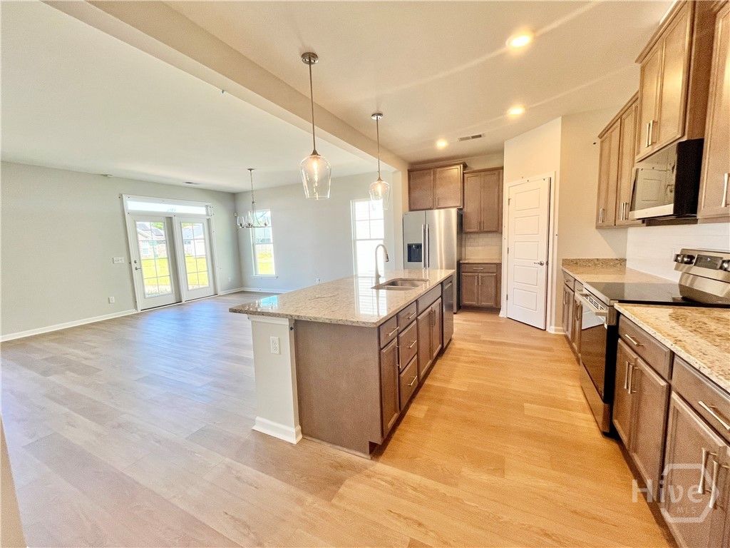 Massive kitchen with open concept design to living
