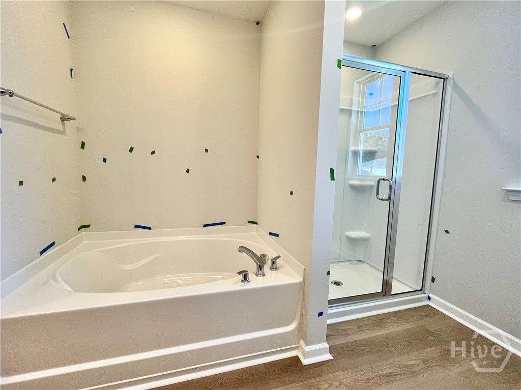 Separate shower & garden tub in primary bathroom