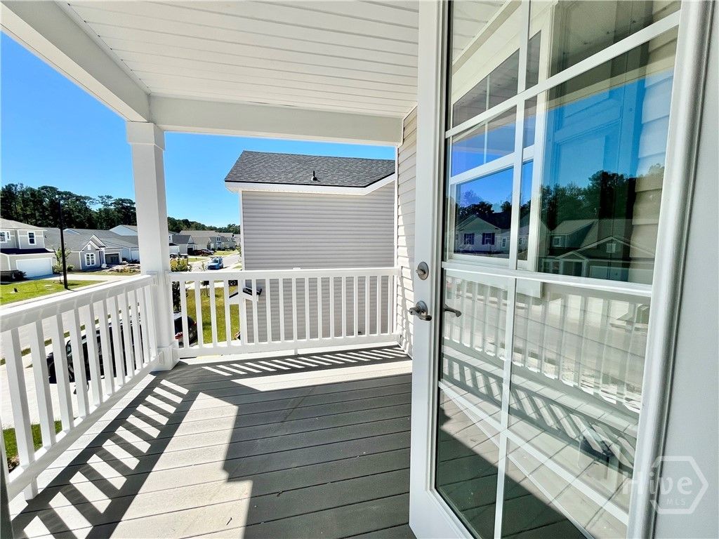 Private balcony off primary bedroom.