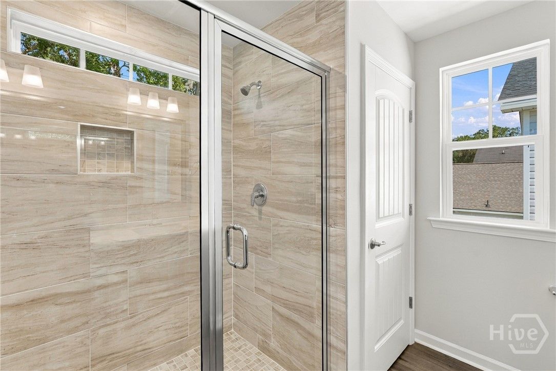 Primary bathroom with 6' tiled shower with a bench