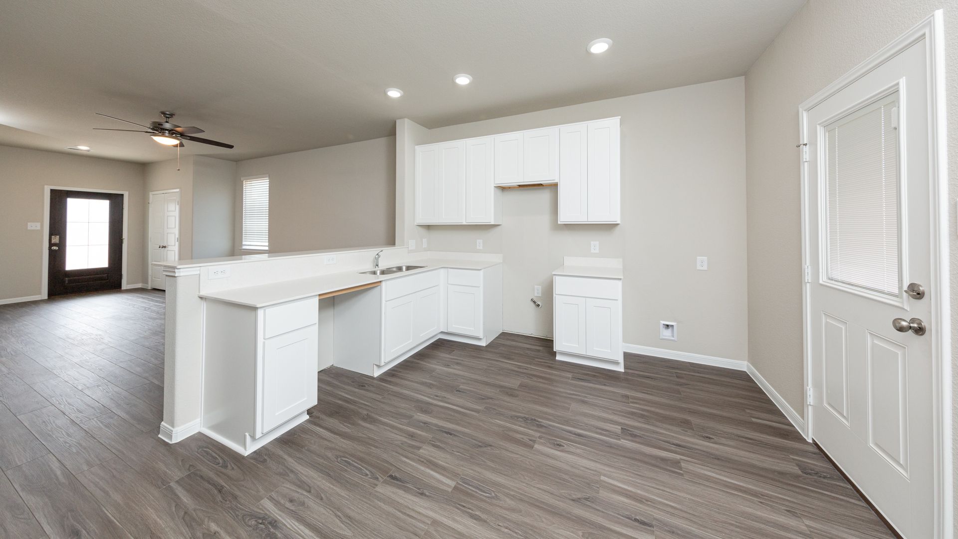Kitchen and Dining Area to Family Room