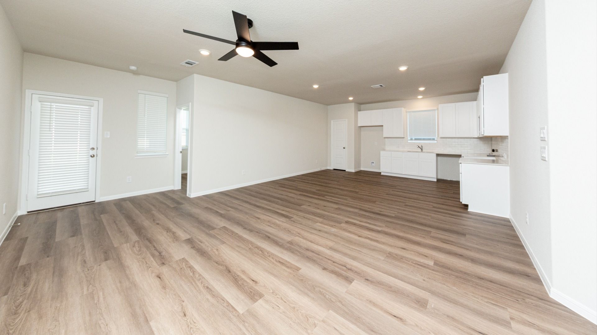 Family Room to Dining, Kitchen, and Secondary Bedroom