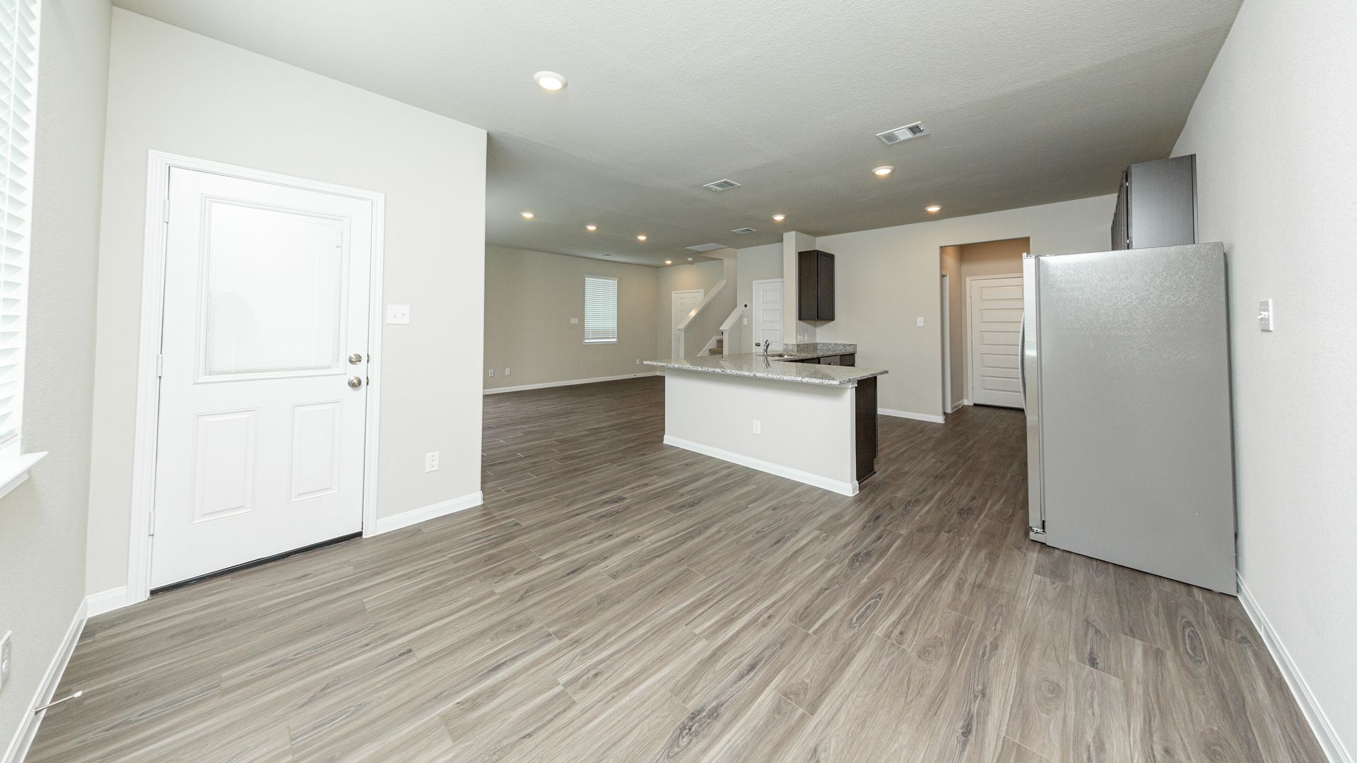 Dining Area to Kitchen and Family Room