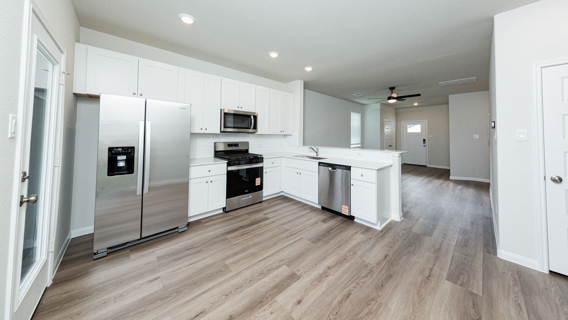 Kitchen and Dining Area to Family Room