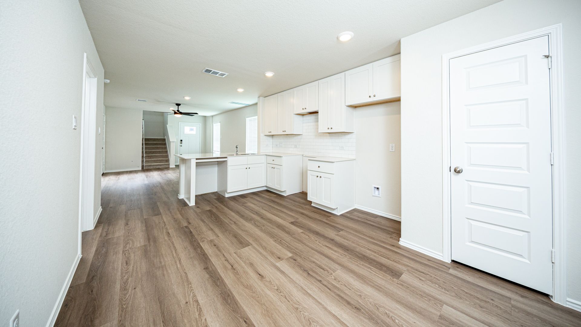 Kitchen and Dining Area to Family Room