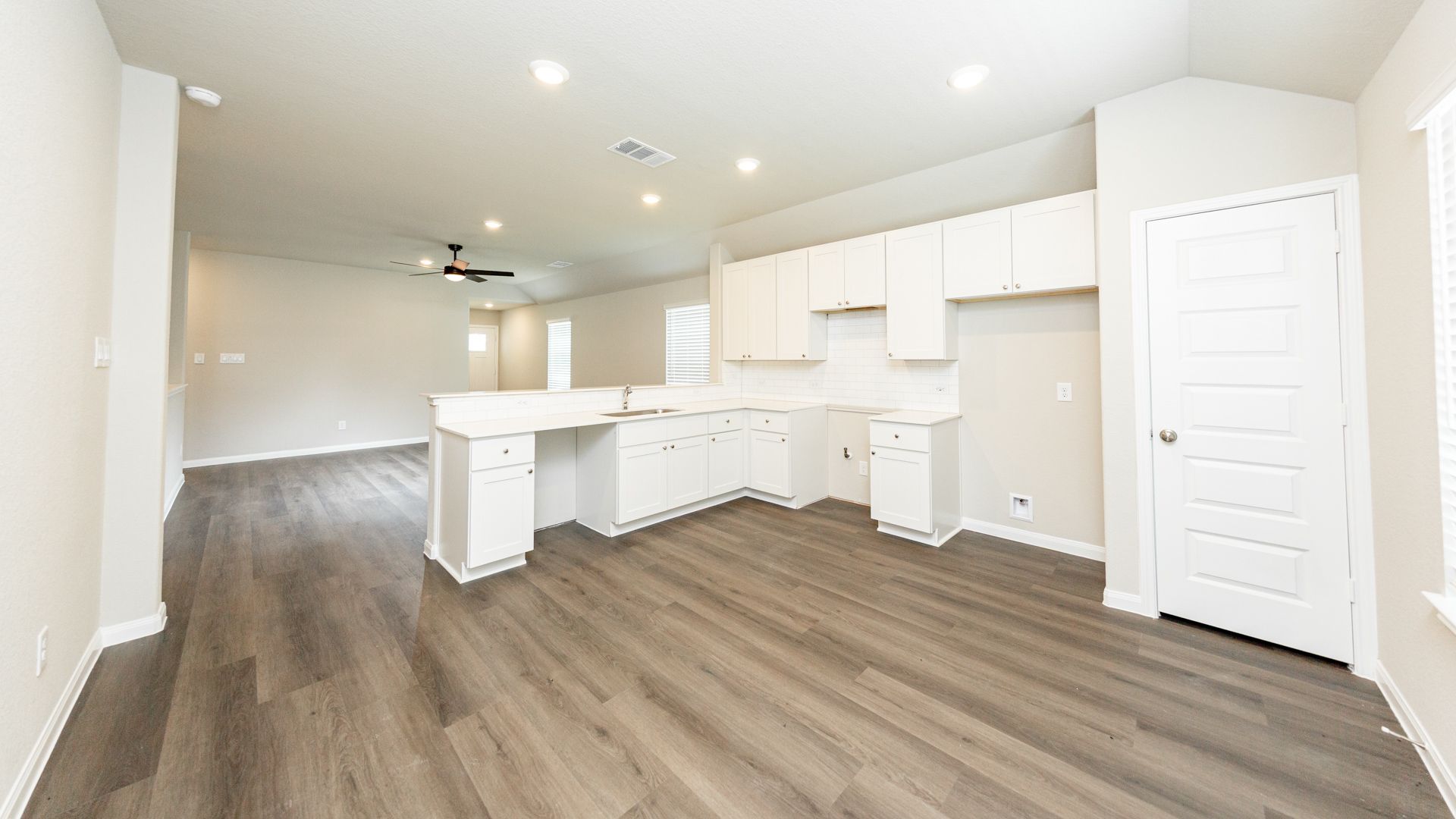 Kitchen and Dining Area to Family Room