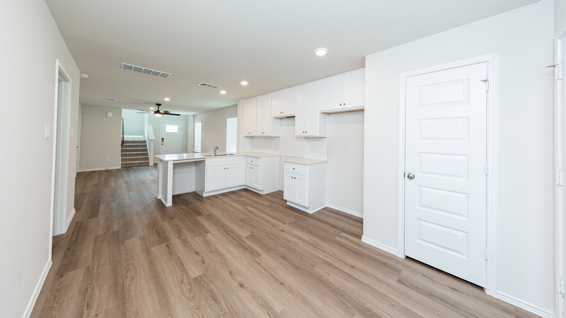 Kitchen and Dining Area to Family Room