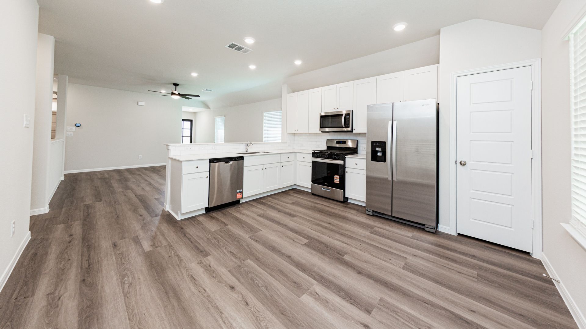 Kitchen and Dining Area to Family Room