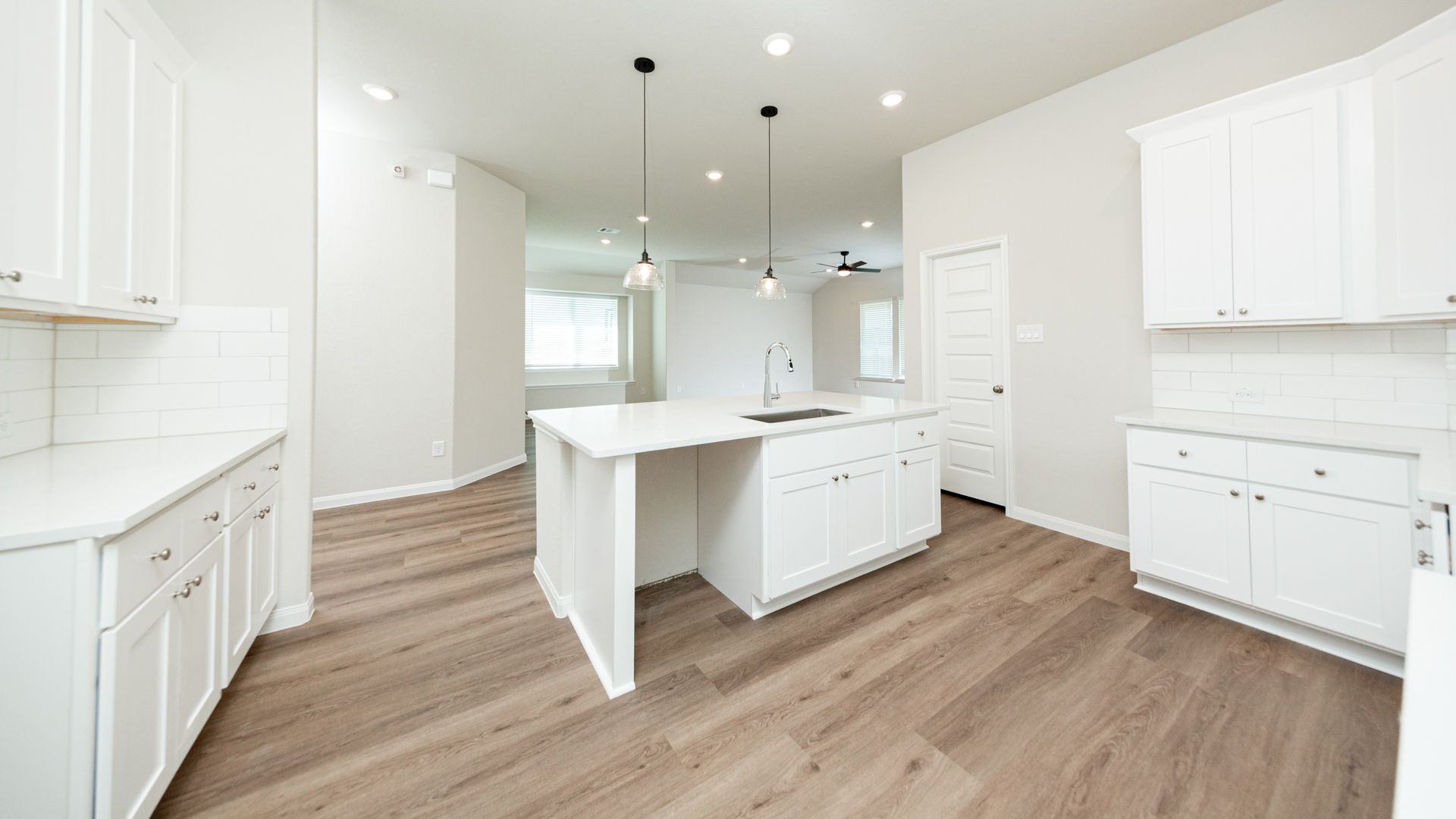 Kitchen to Dining Area and Family Room