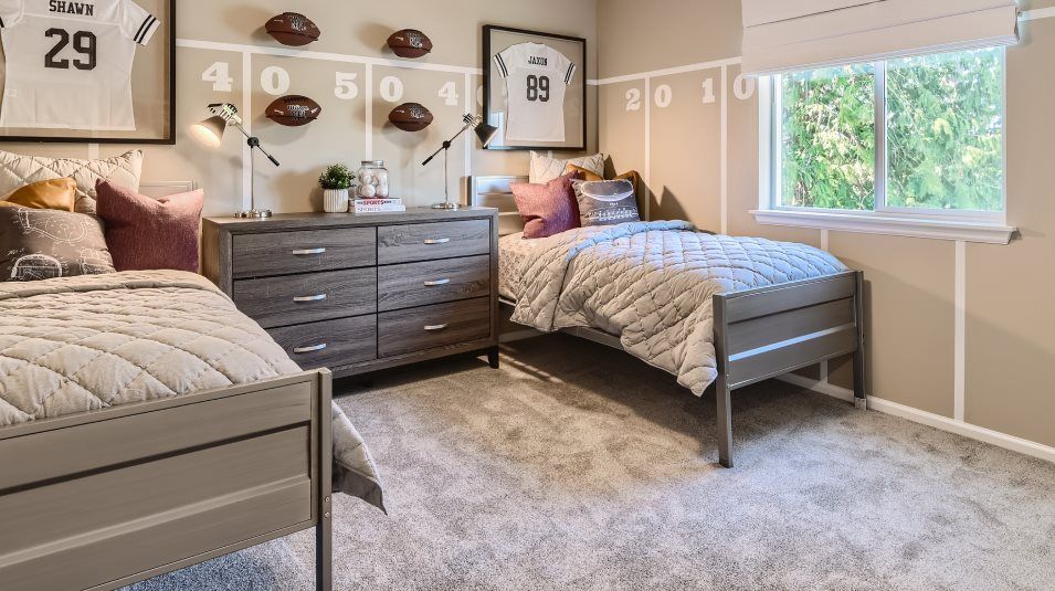 Bedroom with two beds and carpeting