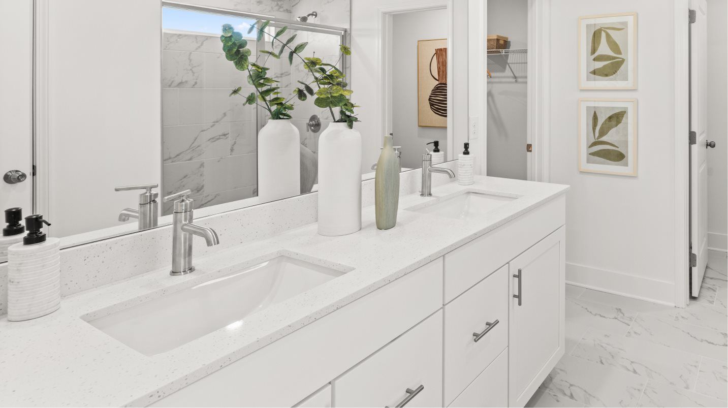 Owners Shower with glass enclosure and quartz countertop