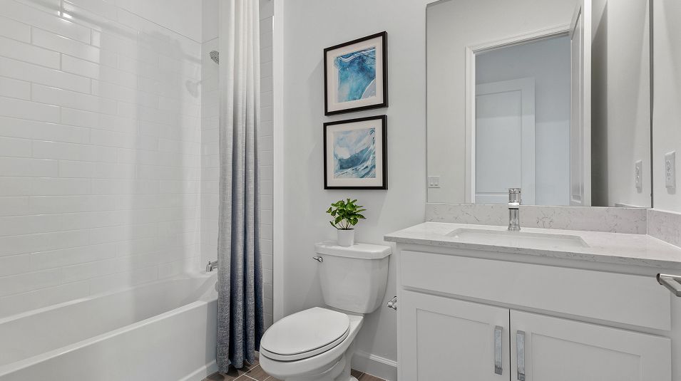 Secondary bathroom tub with tile surround