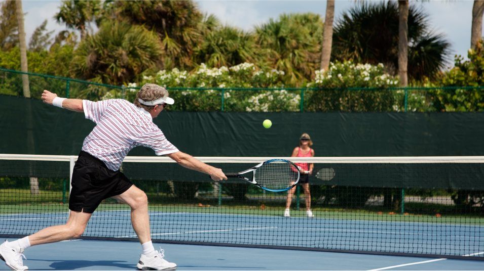 Active adults playing tennis