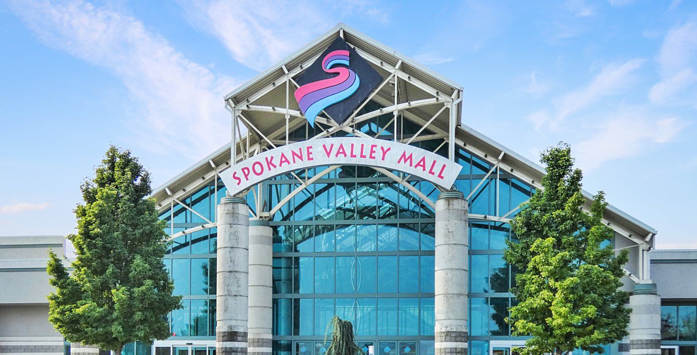 Spokane Valley Mall entrance. It is made almost entirely of blue glass panes
