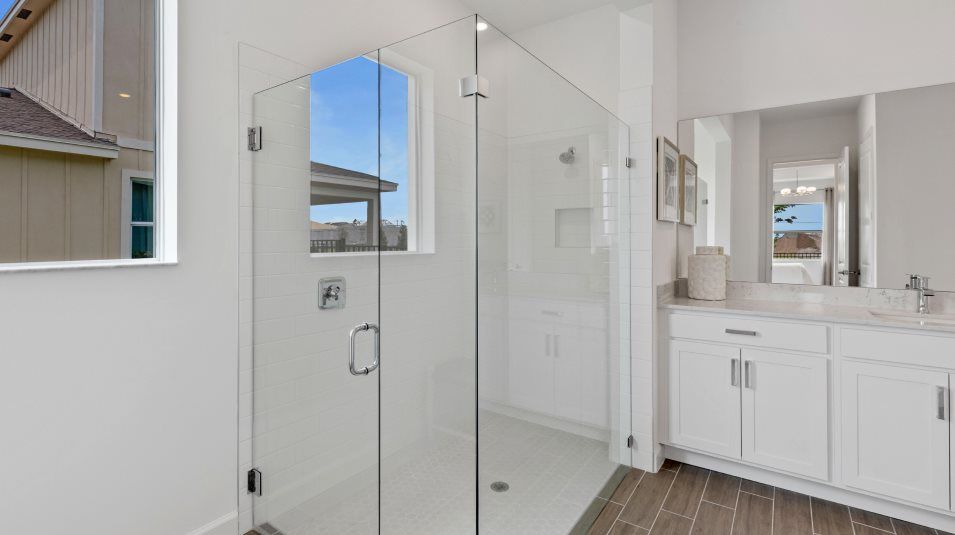 Frameless glass enclosure shower