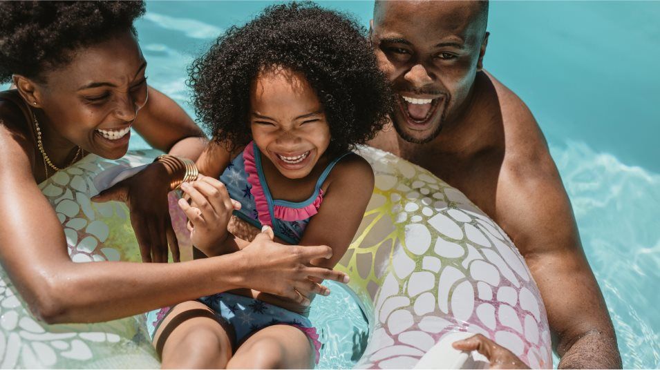 Family swimming in a pool