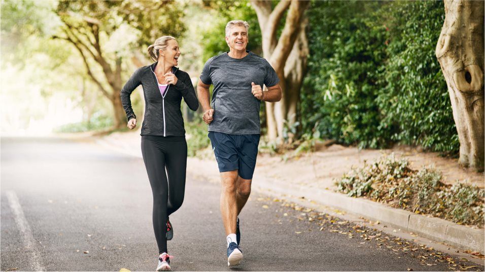 Active Adults walking on trail