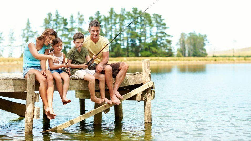 Family fishing on a dock