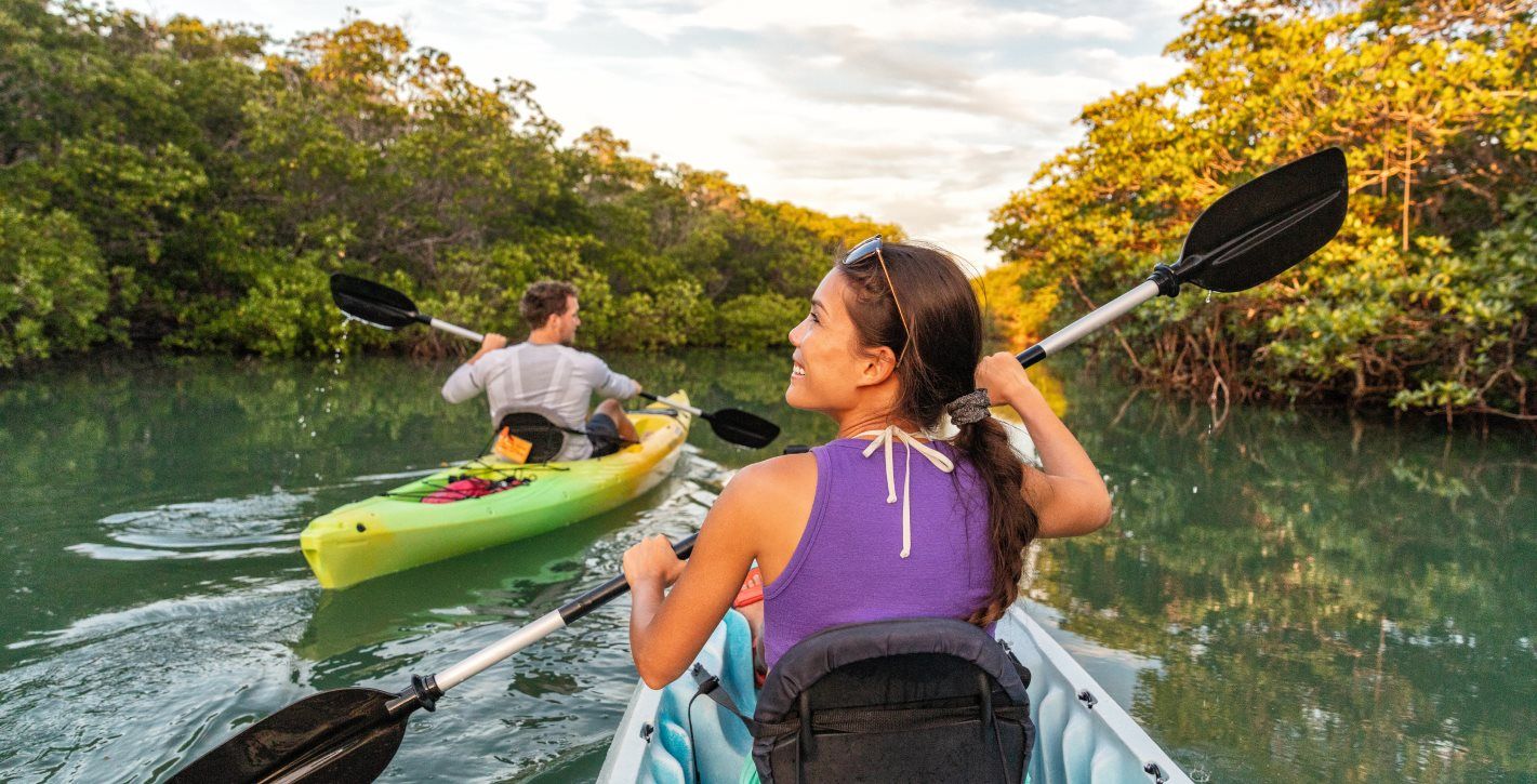 Couple kayaking in a river