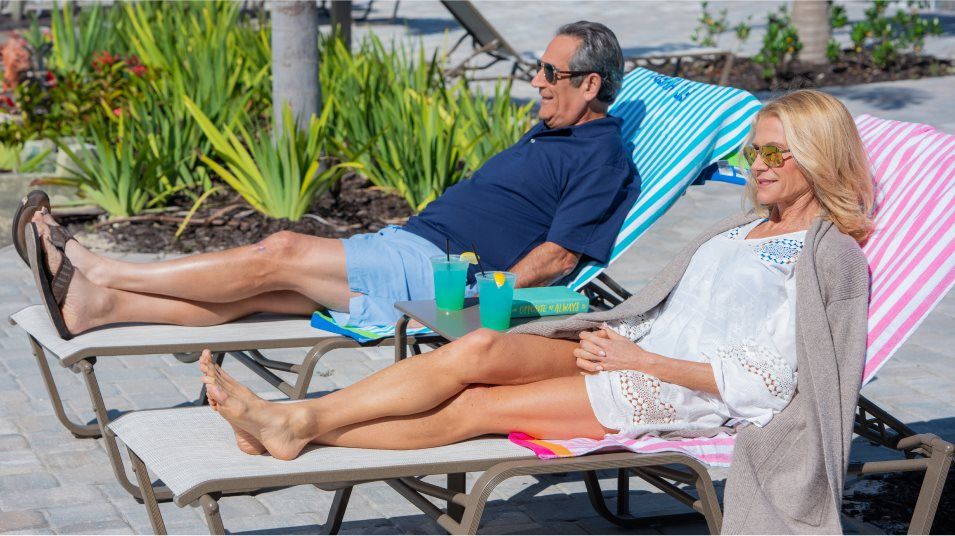 Couple lounging near the pool