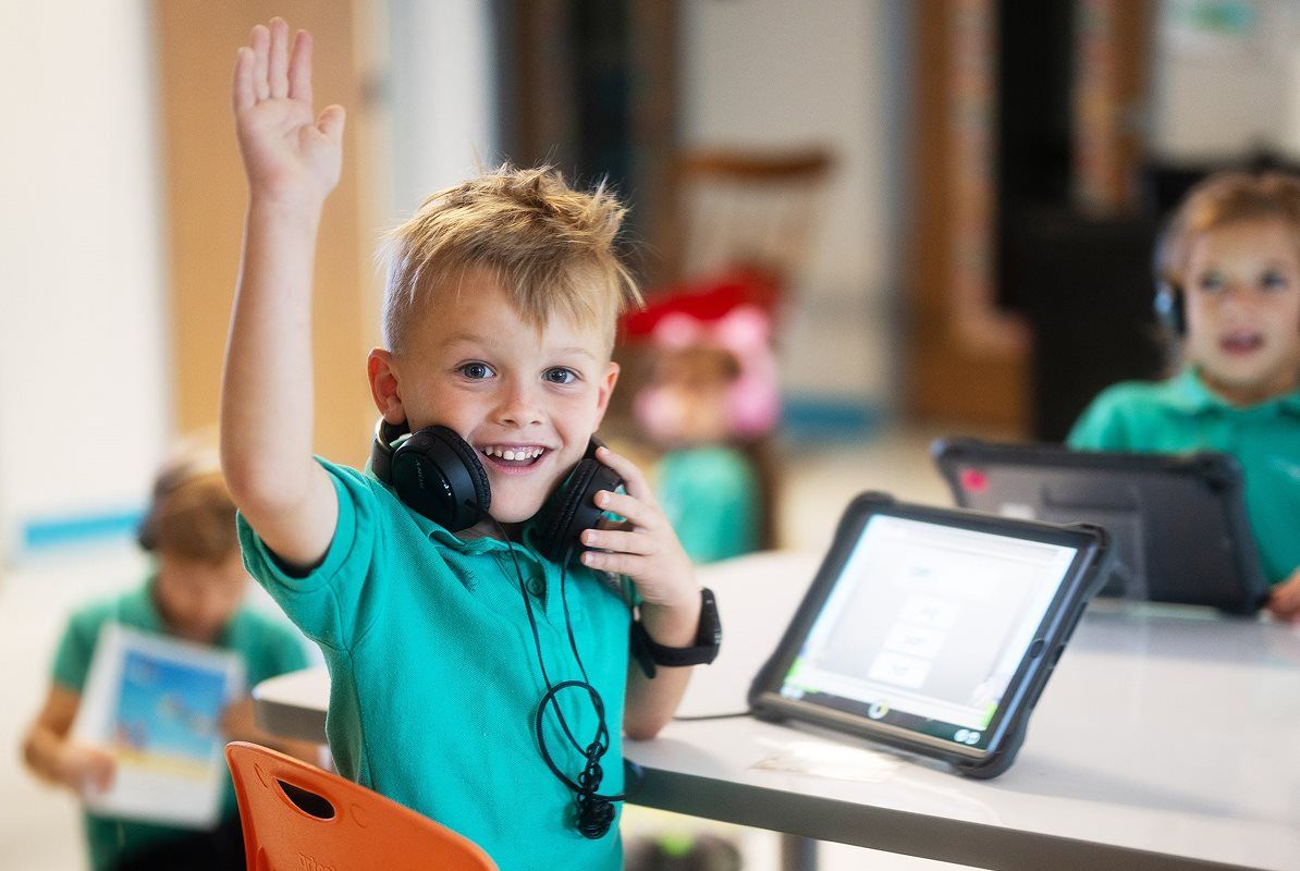 Child with hand raised