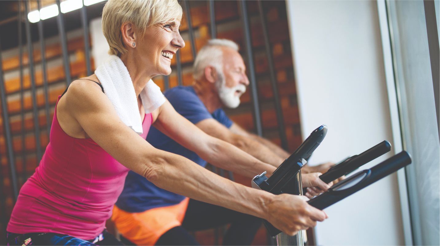 People cycling indoors