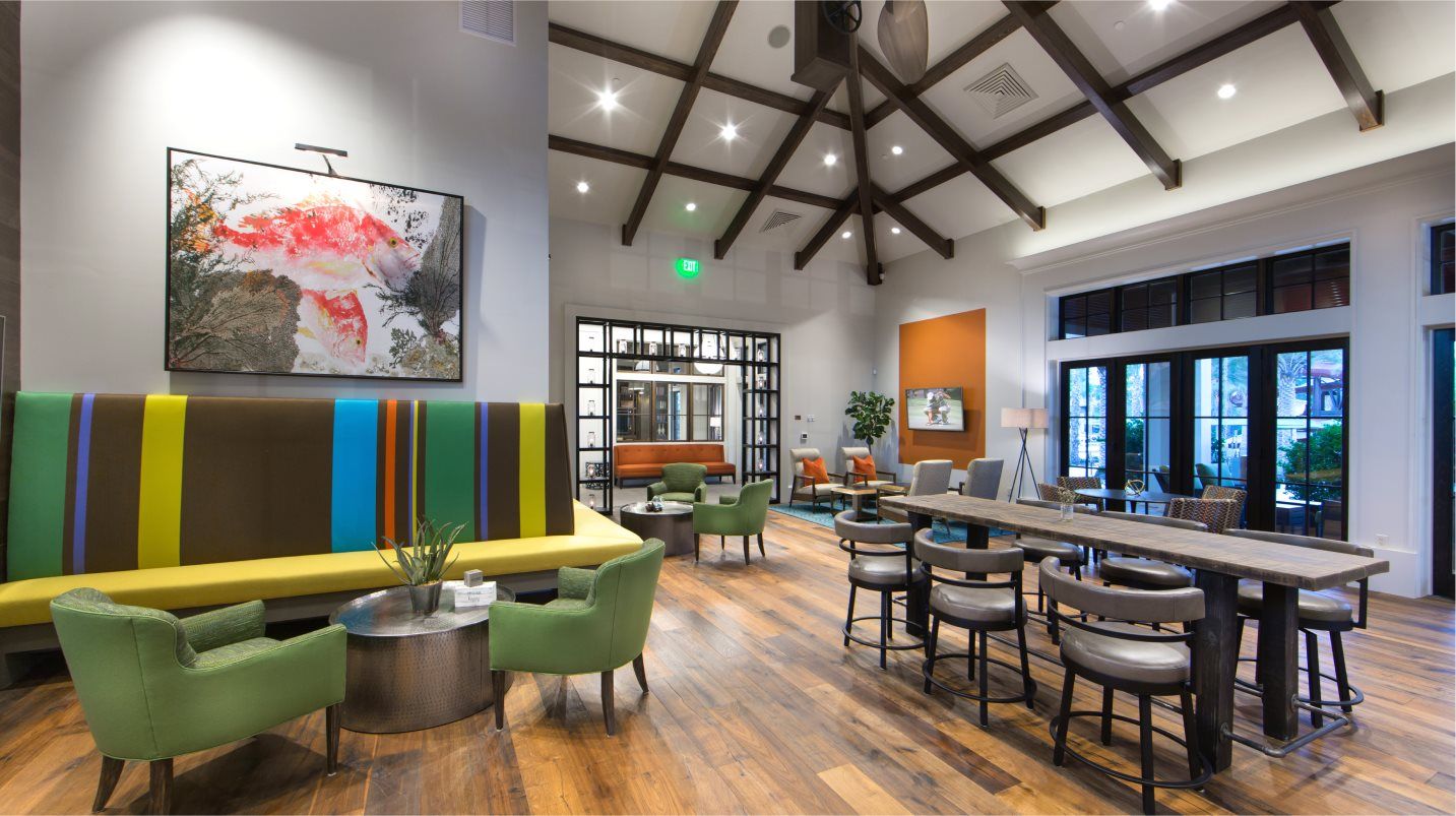 Alternate view of Club room with more lounge furniture and tables