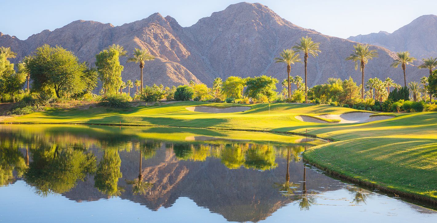 Golf course with mountains in the background