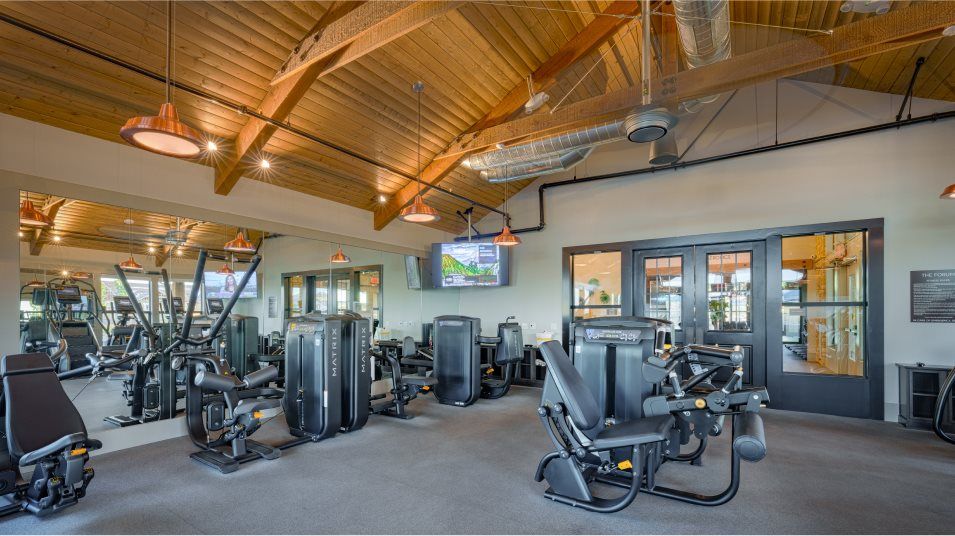 Fitness center interior with lots of machines