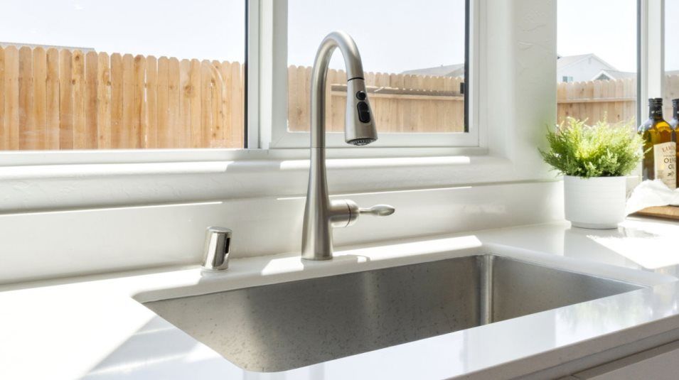 Stainless-steel undermount sink and Moen® pull-down sprayer faucet