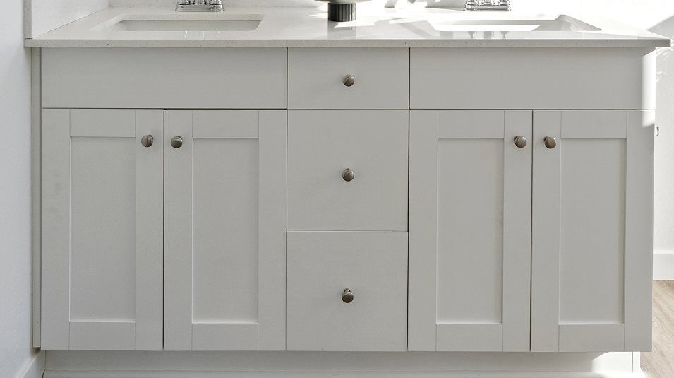 Cabinetry in White Linen in the owner’s suite bathroom
