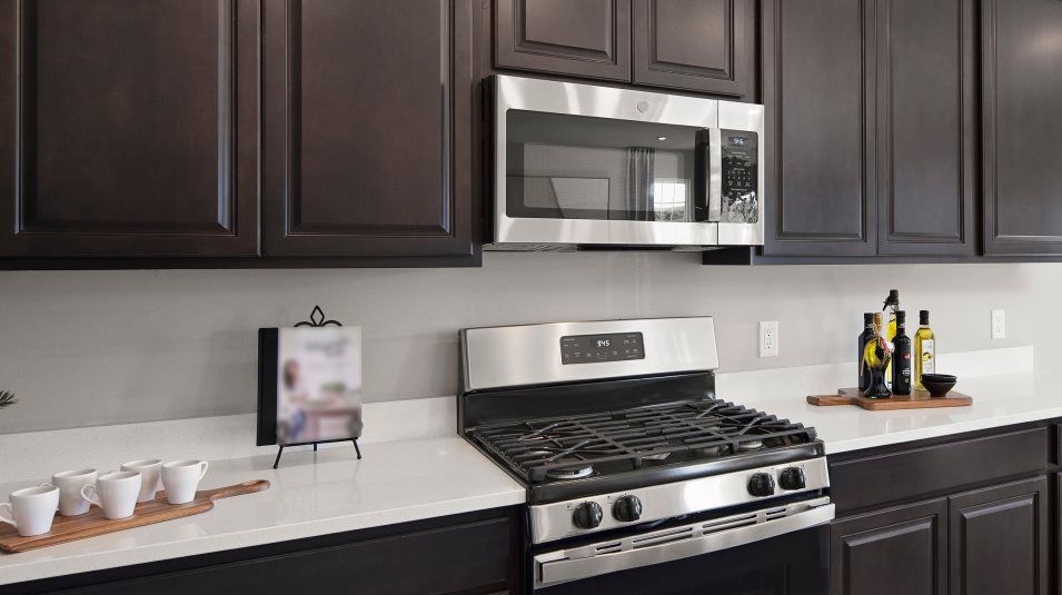 Brand-new kitchen appliance package includes a 4-burner electric range and built-in microwave