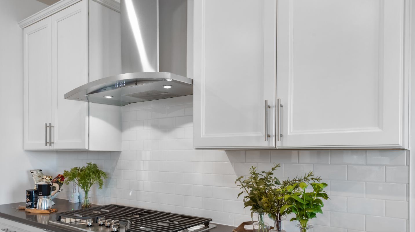 Aristokraft® 42" cabinetry with crown molding provides abundant storage room in the kitchen