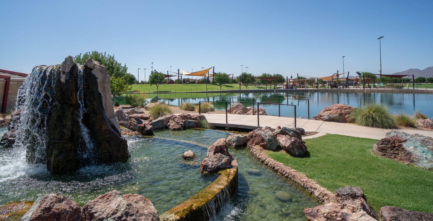 Fountain with a rock sculpture overlooking the park