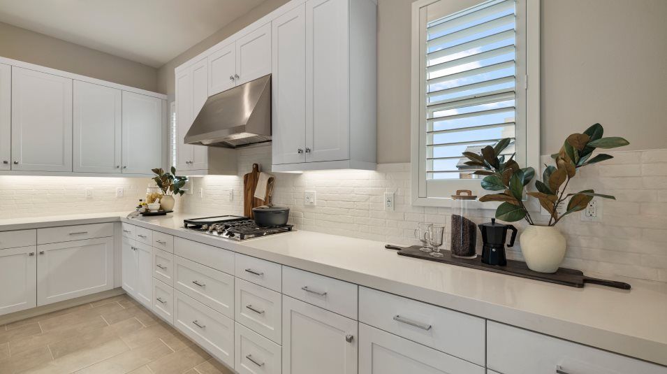Countertops in the kitchen lit up by task lighting